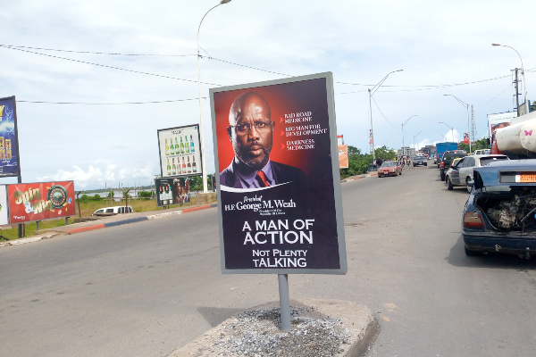 A propaganda promotional billboard erected by the city council of Monrovia portraying the president