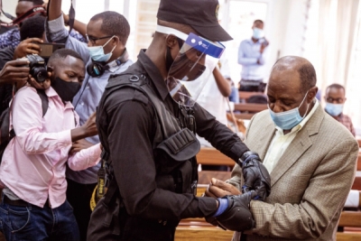 Back in the limelight: Paul Rusesabagina in handcuffs in Kigali, Rwanda.