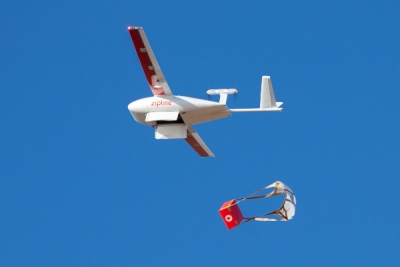 One of Zipline&#039;s drones dropping off a delivery.