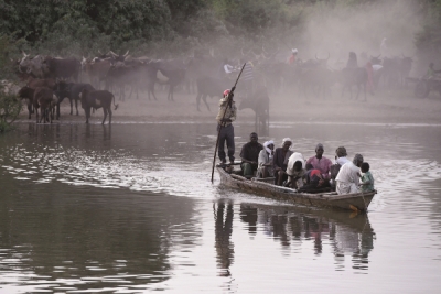 People cross a section of Lake Chad whose waters border Niger, Nigeria and Cameroon. Getty