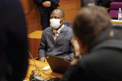 Sierra Leonean national Gibril Massaquoi wears a face mask during the first day of his trial in Tampere, Finland, on February 3, 2021. Getty