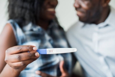 A couple with a positive pregnancy test.