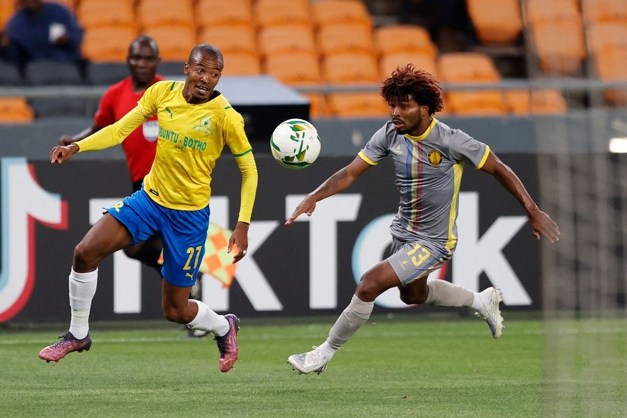 Sundowns&#039; Thapelo Morena (left) vies for the ball with Luanda&#039;s Augusto Carneiro (right) during the CAF Champions League second leg semi-final at the FNB Stadium in Johannesburg on Apri