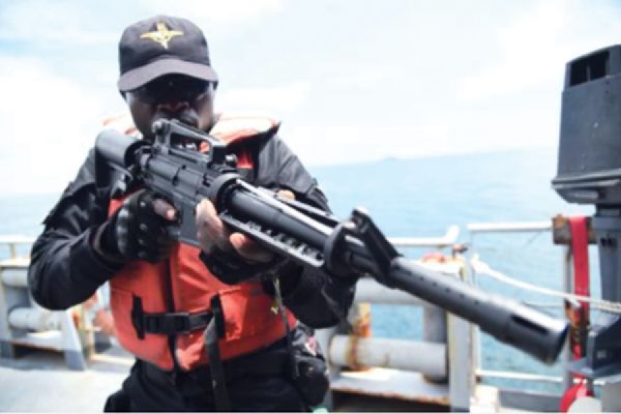 Nigerian maritime official poses for photo during anti-piracy training.